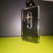 Bottle with a label featuring the number '9' on a dark background